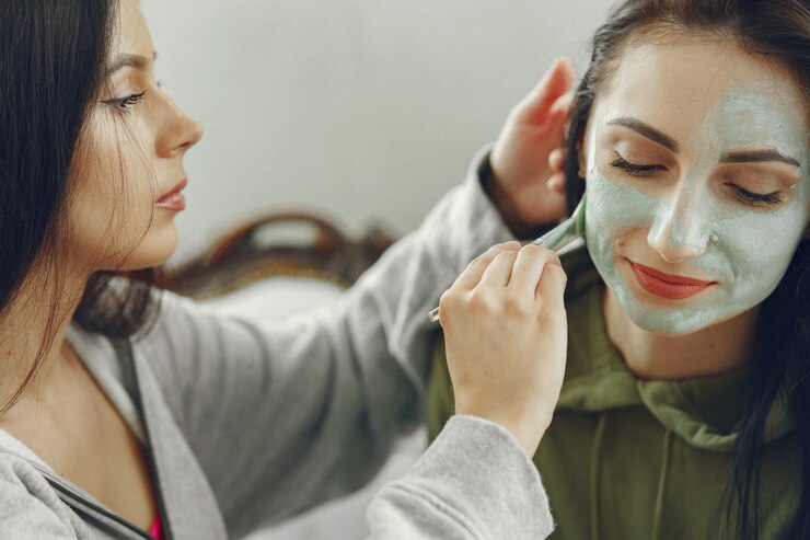 Close-up of a woman receiving a chemical peel facial treatment at EA Wellness MedSpa in Chantilly, VA for brighter, clearer skin.