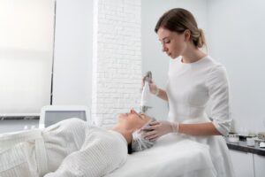 Woman enjoying a Hydrafacial treatment at EA Wellness MedSpa in Chantilly, VA for radiant, glowing skin.