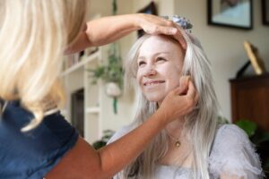 Middle-aged woman with glowing, youthful skin after anti-aging treatment at EA Wellness MedSpa in Chantilly, VA.
