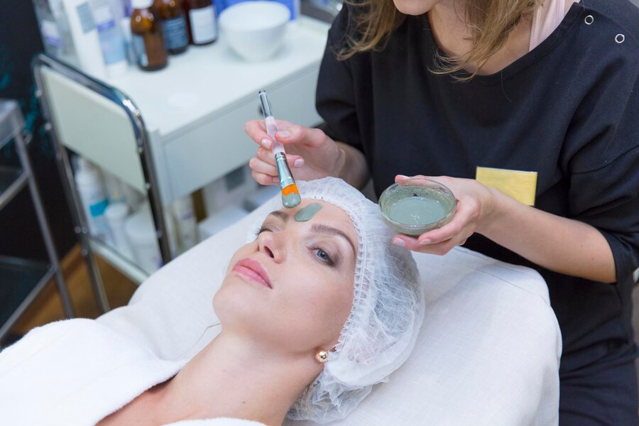 Woman receiving a professional chemical peel treatment at a medspa in Chantilly, VA